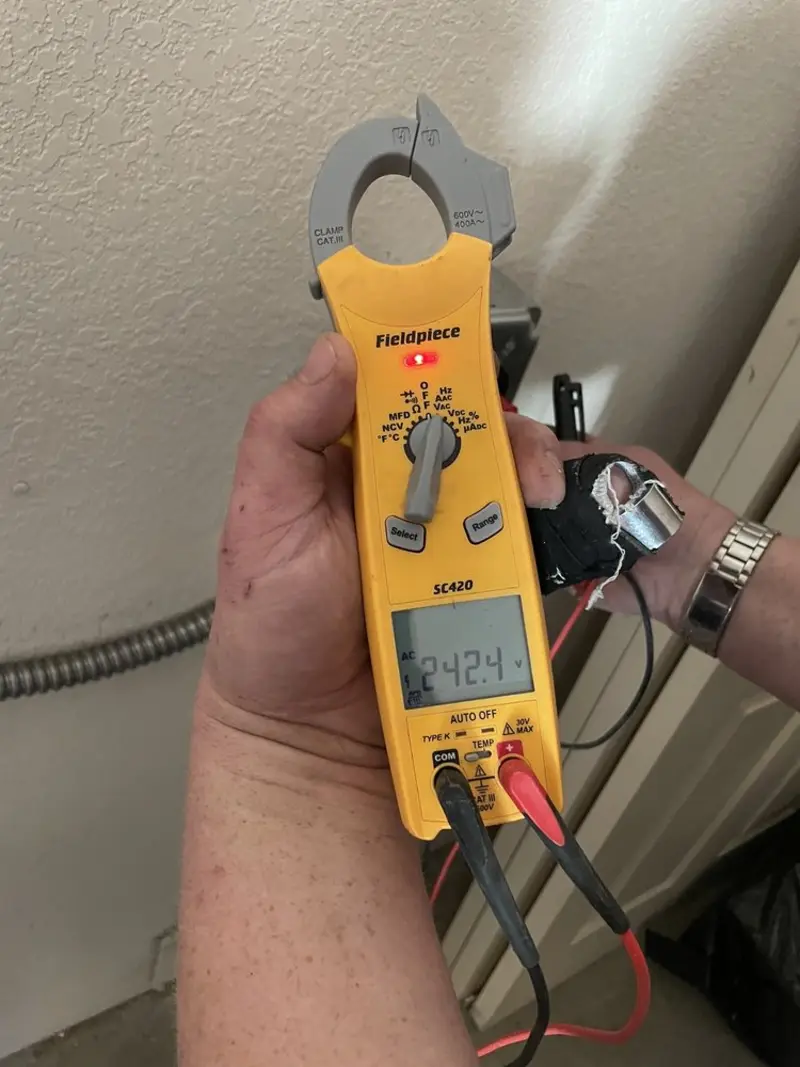 Voltage testing with clamp meter during Recessed Lighting Installation in Breckenridge Hills